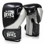 High Precision Training Glove Velcro - Black/Silver featuring a pair of 12 oz boxing gloves with the name Clef Reeves.